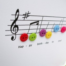 Geburtskarten gestalten musiknoten bunte knoepfe.jpg