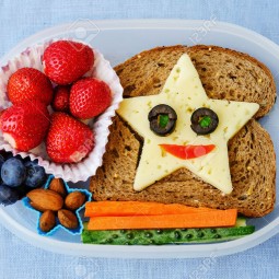 42738821 school lunch box for kids with food in the form of funny faces stock photo.jpg