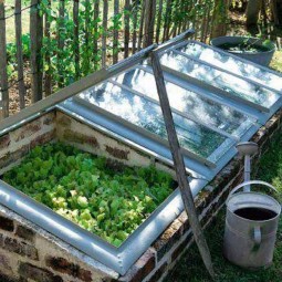 04 mini greenhouse made from recycled bricks and windows.jpg