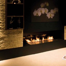 Interior fireplace design idea with brown stone wall and book on the cream floor elegant fireplace design ideas 1220x812.jpg