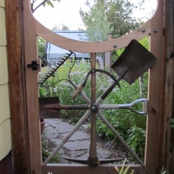 Garden gate with repurposed garden tools.jpg
