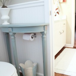 Add a half table over a toilet paper holder for extra storage.jpg