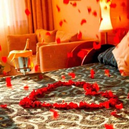 Bedroom decoration for valentines day with rose petals.jpg