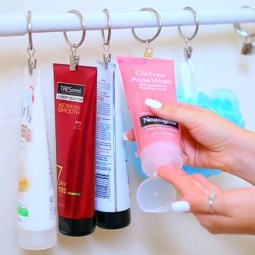 Diy tips for an organized bathroom shower hack use a tension rod and rings with clips to keep your shampoo and body washes up off of the floor and easily accessible id.jpg