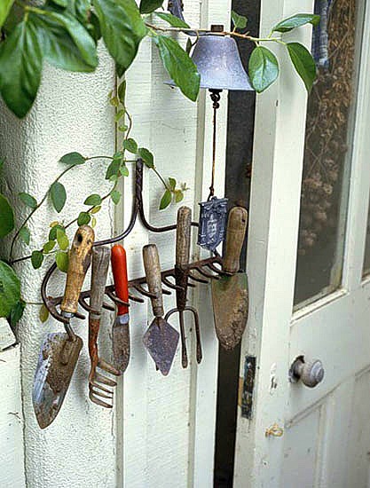 Rake repurposed as a garden tool holder.jpg