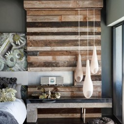 Rustic bedroom with textured wood wall feature.jpg
