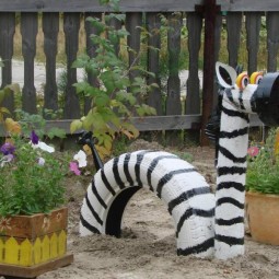 Kreative gartenideen zebra autoreifen sandkasten kinder.jpg