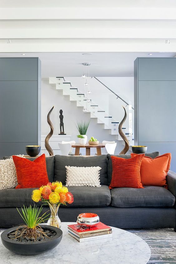Stylish grey and orange living room.jpg