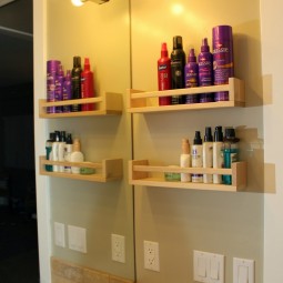 Take the spice racks into the bathroom and use them as storage for all of your hair styling and makeup products.jpg