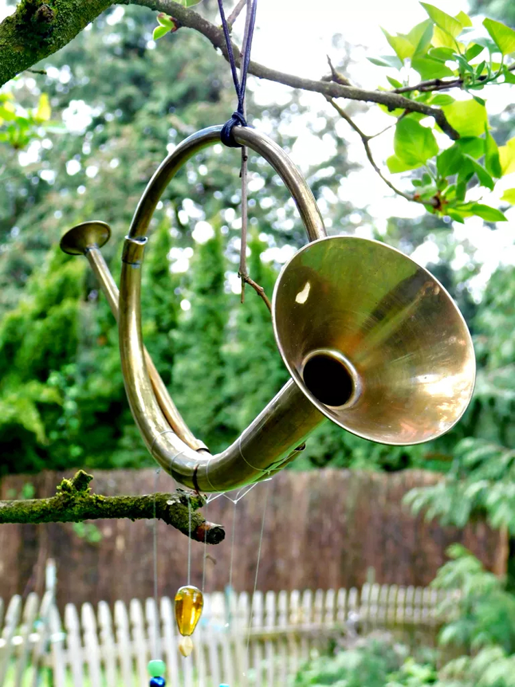 Transform a thrift store horn into an eye catching wind chime.jpg