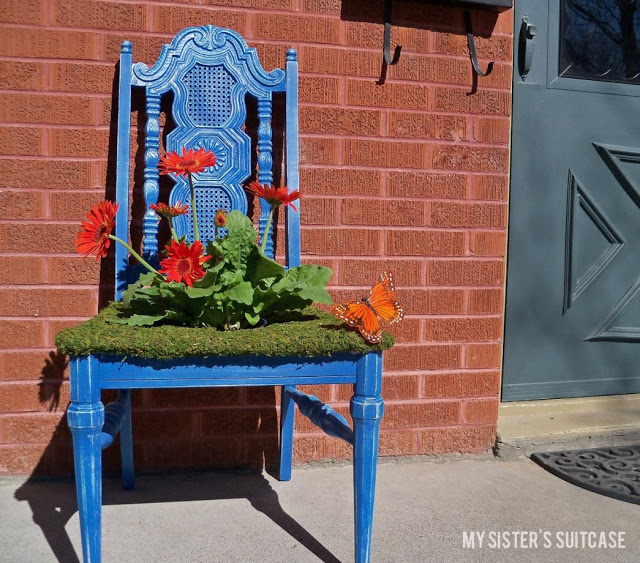 Use old wooden chairs to make some adorable planters for your yard.jpg