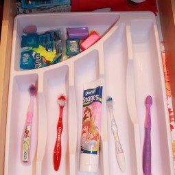 Use plastic silverware tray for organizing toothbrushes and toothpaste.jpg