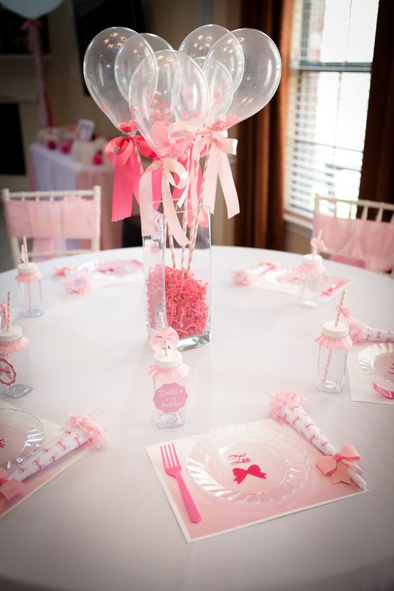 06 a vase filled with pink stuff and sheer balloons on straws.jpg