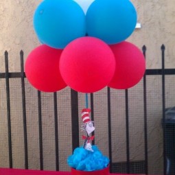 07 a pot with a toy and colorful balloons attached.jpg