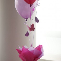 08 a fence with colorful paper and balloons with butterflies for a girls party.jpg