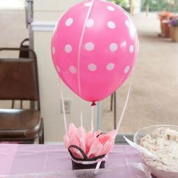 11 a pink polka dot centerpiece with plastic tableware is functional.jpg