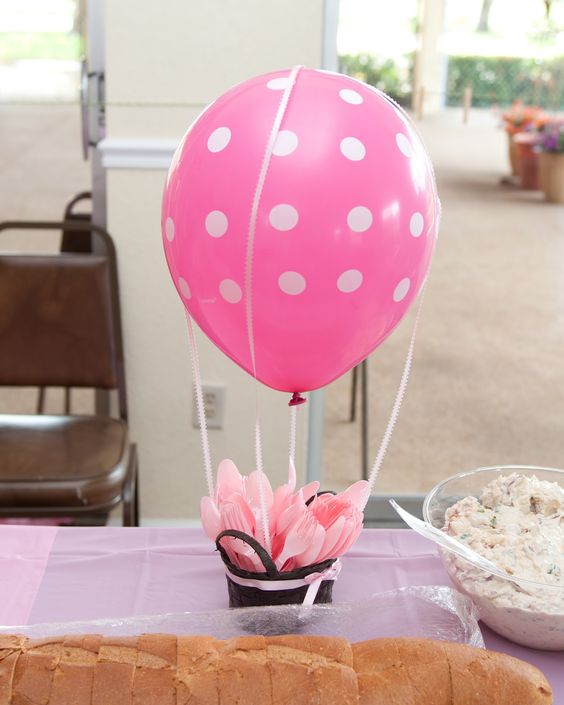 11 a pink polka dot centerpiece with plastic tableware is functional.jpg