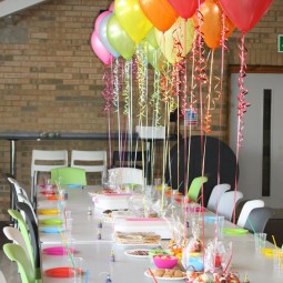 13 attach colorful balloons to the table to create floating decor.jpg