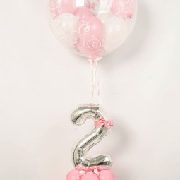 17 pink balloons with a silver number and a large balloon with balloons inside.jpg