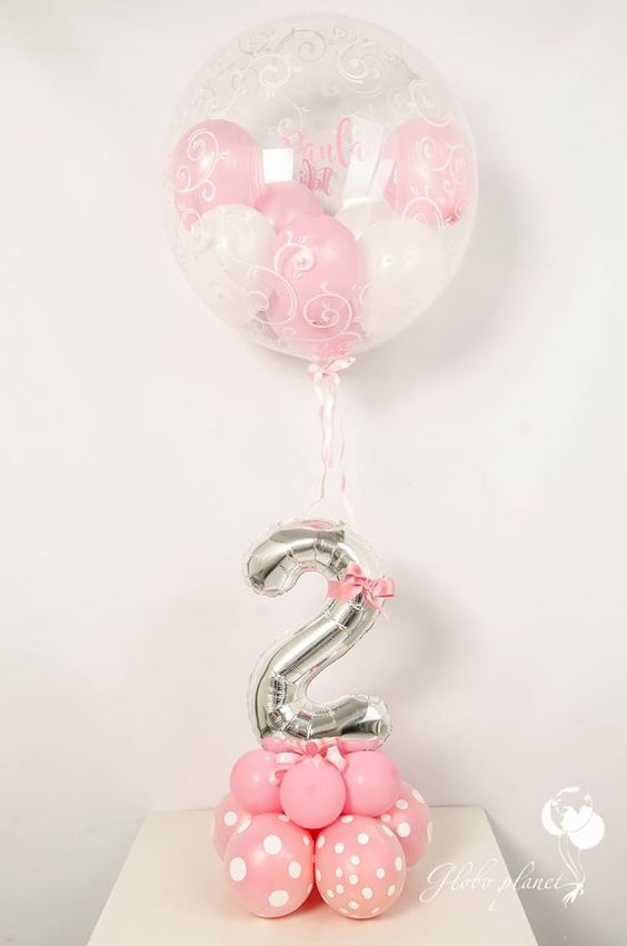 17 pink balloons with a silver number and a large balloon with balloons inside.jpg