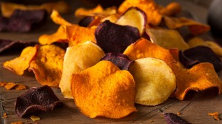 Healthy Homemade Vegetable Chips on a Cutting Board