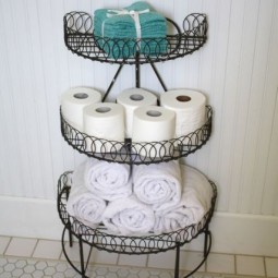 Repurpose wire plant stand to corral towels and toilet paper.jpg