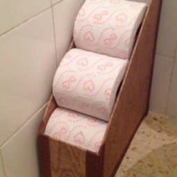 Store extra toilet paper in the magazine holder.jpg
