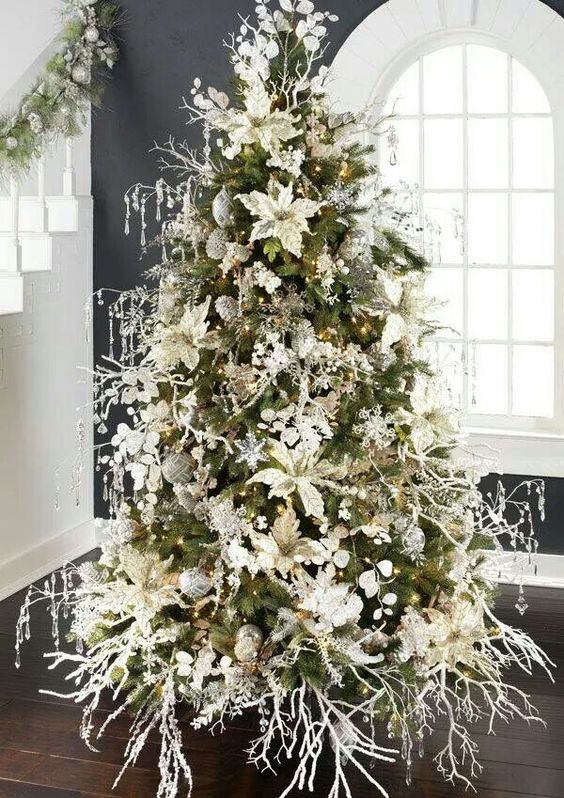Magnificent floral and crystal ornaments on this white christmas tree.jpg