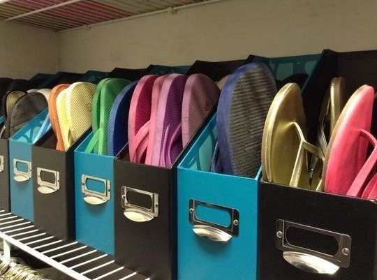 Use old magazine holders to store flip flops and sandals.jpg