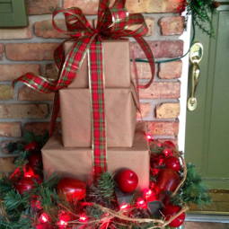 Holiday christmas outdoor decoration front porch_packages stack.png