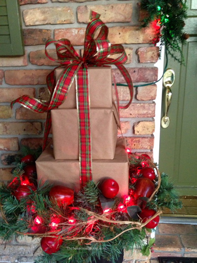 Holiday christmas outdoor decoration front porch_packages stack.png