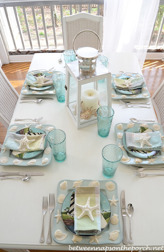 Beach table setting with shell and sailboat plates aa 1.jpg