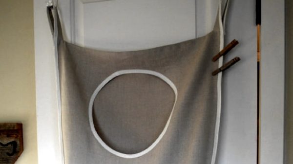Door hanging laundry hamper clothes storage hack e1462996617618.jpg