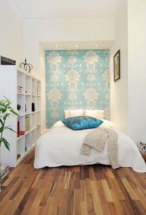 Very small bedroom design with white bed sheet with blue pillow and white wall with blue wallpaper accent together with brown hardwood floor tile comfy ideas for very small bedroom.jpg