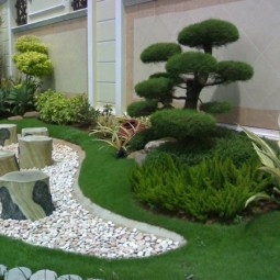 Garten mit steinen gestalten originell baumstaemme.jpg