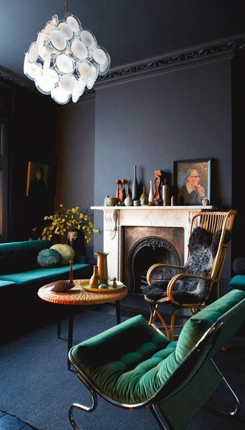 02 navy and black living room with emerald furniture and an antique fireplace.jpg