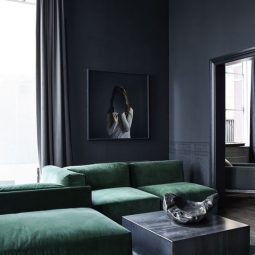 04 elegant graphite grey living room with an amazing emerald green sofa.jpg