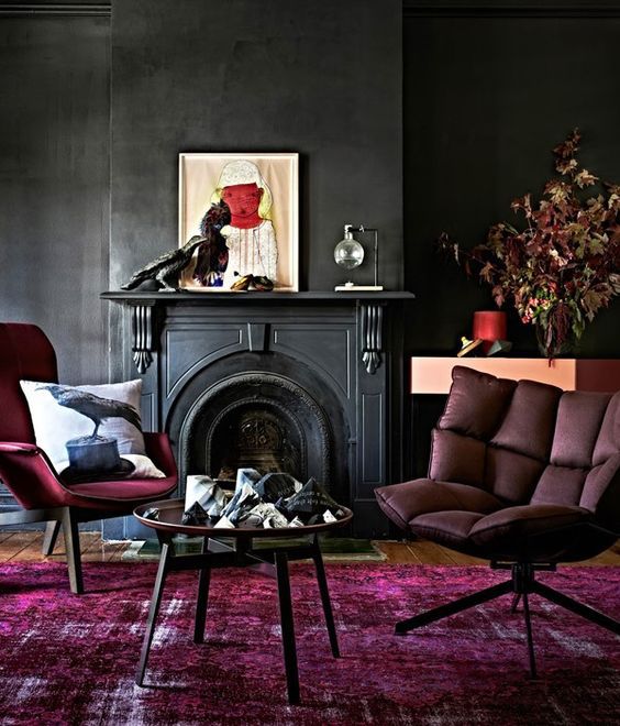 08 black walls and red and fuchsia furniture and a carpet.jpg