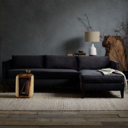 21 dark grey walls a black sofa and raw wood furniture for a natural feel.jpg