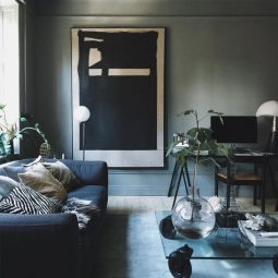 24 grey walls a navy sofa and a modern large scale artwork.jpg