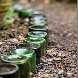 Glass bottles used as path edging feature in small garden_thumb.jpg