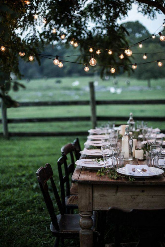 13 unexpected uses for christmas lights how to decorate with string lights outdoor dinner party 590378bc40a5bb2033934c58 w620_h800.jpg