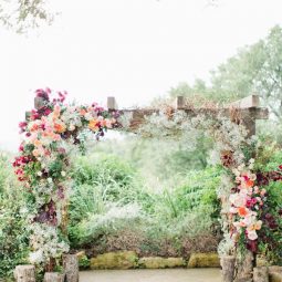 Pastel roses rustic wedding arch ideas.jpg