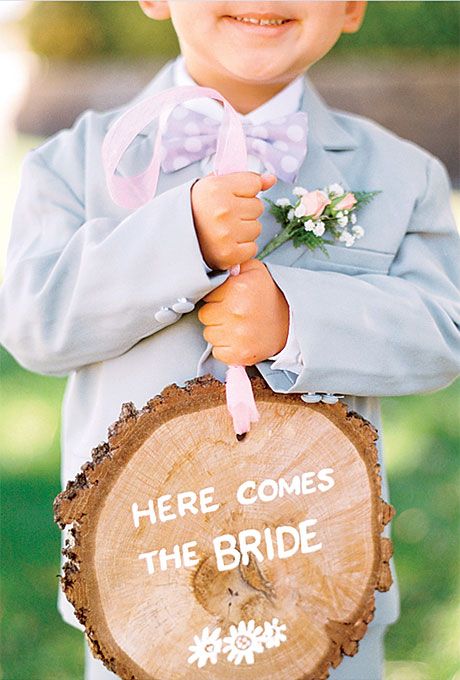 Ring bearer and signs on tree stump.jpg