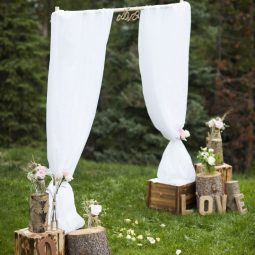 Simple rustic tree stump wedding altar.jpg