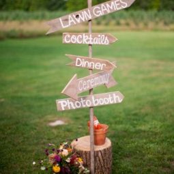 Wood sign directed guests to various wedding activities.jpg