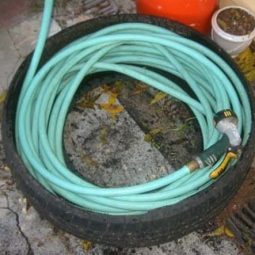 Make a hose caddy out of an old tire.jpg