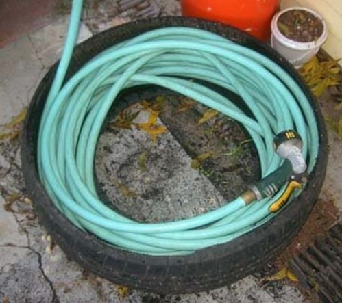 Make a hose caddy out of an old tire.jpg