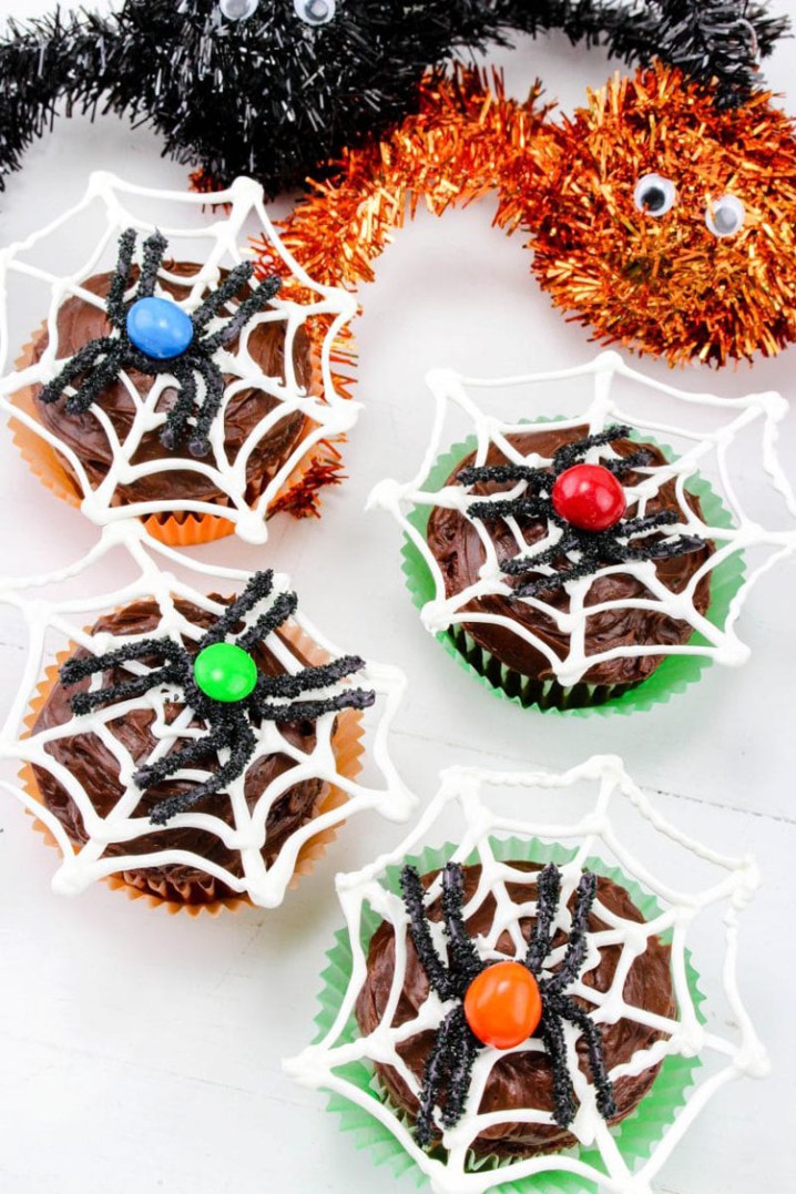 Fun halloween spiderweb cupcakes with chocolate spiders.jpg