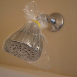Clean a shower head wwith vinegar and a plastic bag.jpg